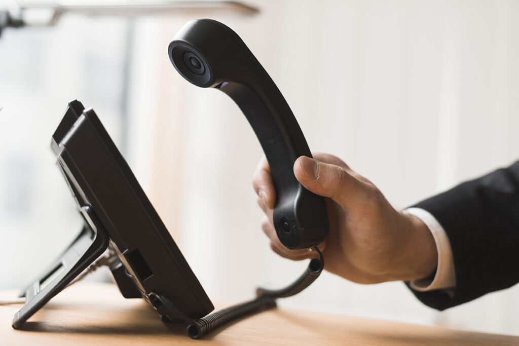 Closeup of a businessman holding headset